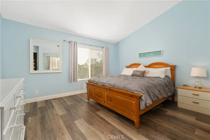 Large primary with vaulted ceilings and a pool view!