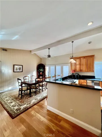 Kitchen with family room shown as dining space