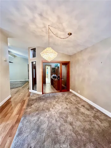 Another view of dining area into cozy office space