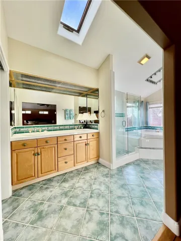 Dual sinks, private toilet room with bidet