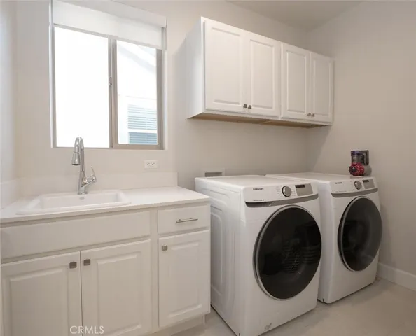 Full size Laundry room w/ window, sink, & storage. Located Upstairs.