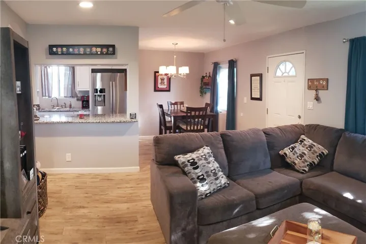 Living room toward dining and kitchen