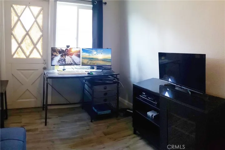 Guest bedroom #2 used as office. Dutch door access to backyard.