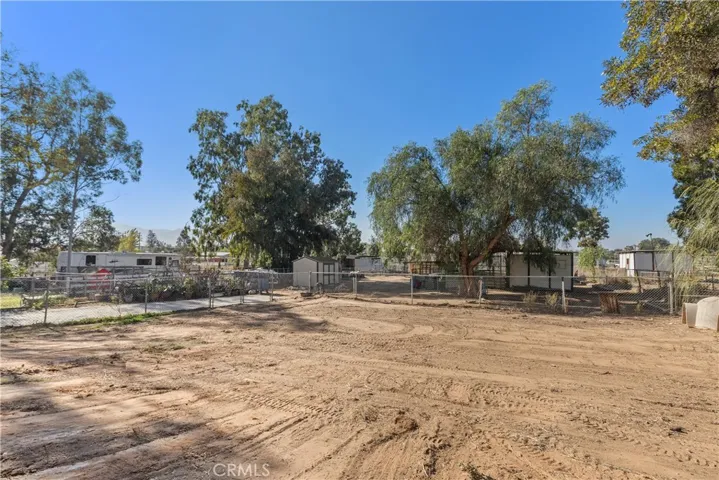 another view of the fenced in yard below the pool area