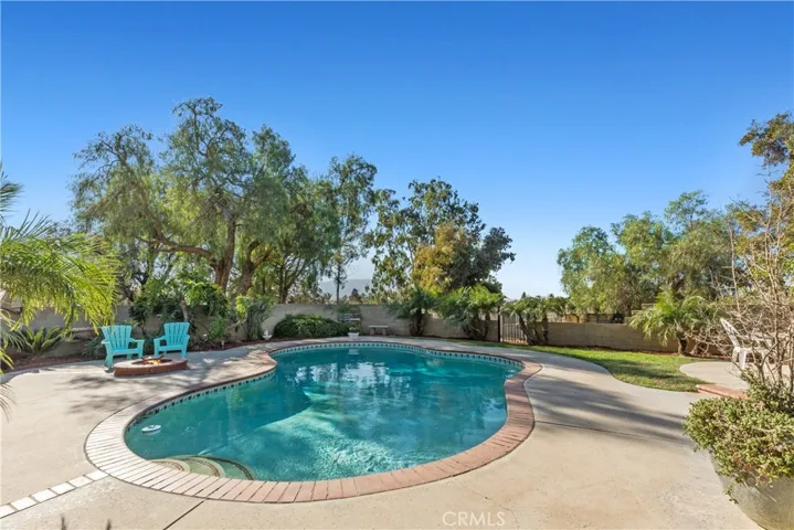 Pool area is fully enclosed by a block wall