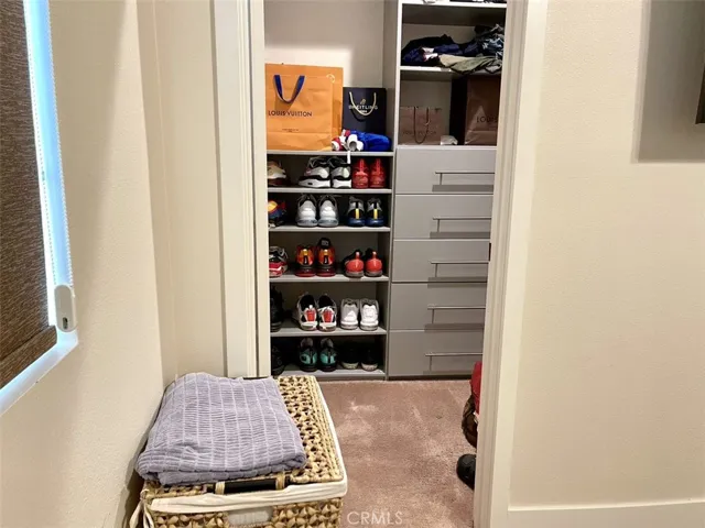 Generous walk-in closet with shoe organizer