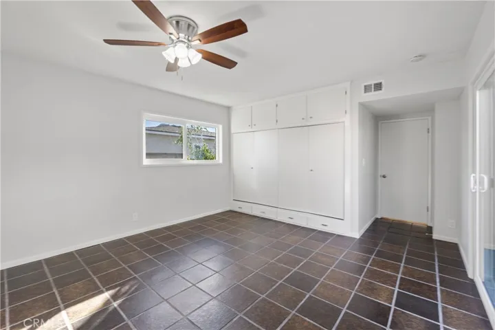 Master bedroom from a different angle. It's the largest bedroom in the home. Hallway is L shaped, with this bedroom being at the end of the hallway. Window views the east side yard. A large throw rug would fit in this room perfectly.