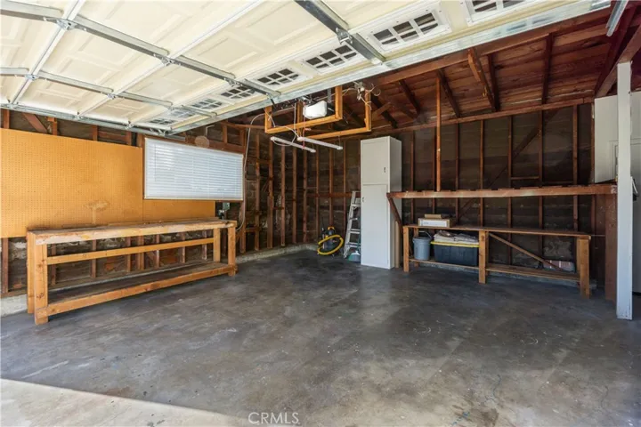 Garage also has a nice size work bench for any projects. Window is double pane and new, as well as the blinds are new. Window faces the front yard.