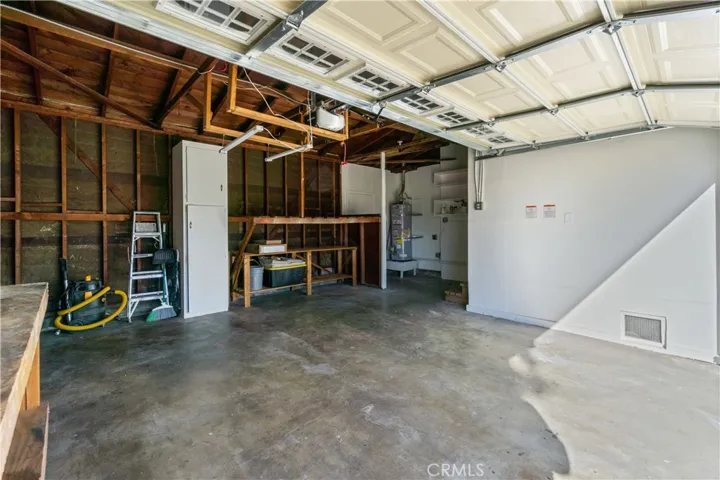 There's a cabinet and shelves for storage. Garage door is automatic and makes entry convenient. Garage has size for a lot of stuff!