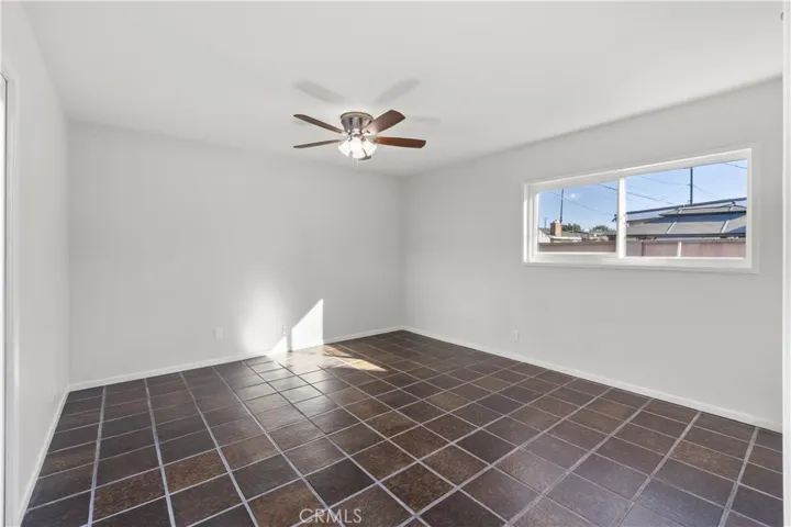 Master bedroom has tile floors, ceiling fan, and new double pane window. Walls were freshly painted.