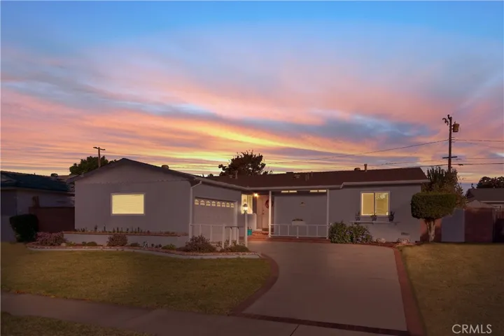 Outside lamps give the home an evening glow.