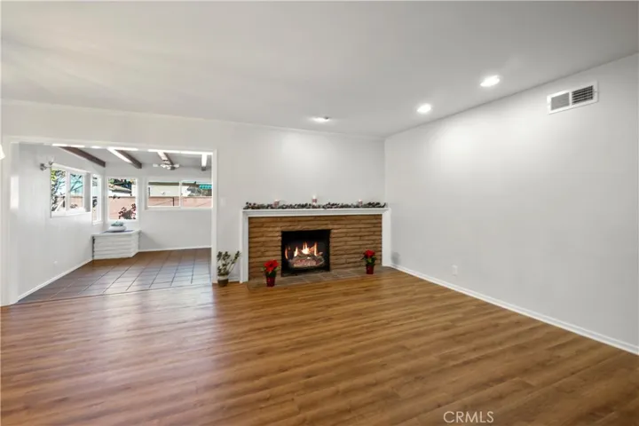 Living room is open to the family room area. All walls have been freshly painted.