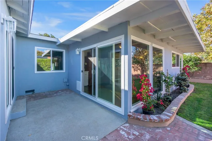 Exterior lighting around the home are all new. Flower beds are adjacent to various parts of the house. Plants and flowers add much to the color throughout the yard. The backyard area is U shaped, as it encompasses the home.