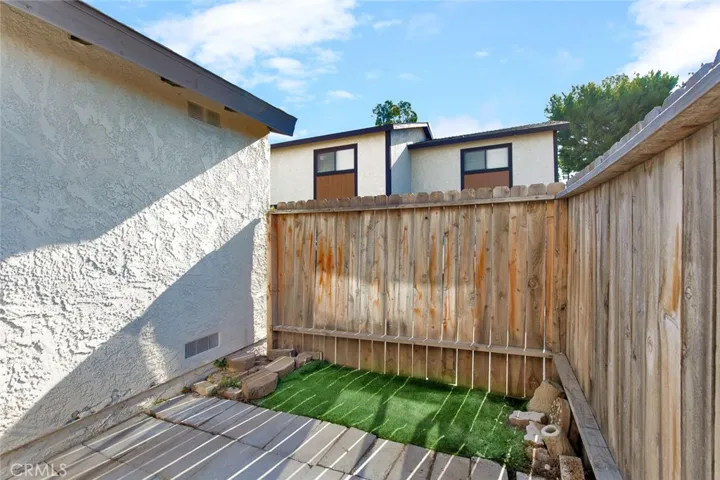 enclosed sun room opens to kitchen, garage and back patio