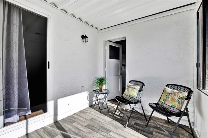 enclosed sun room opens to kitchen and garage.