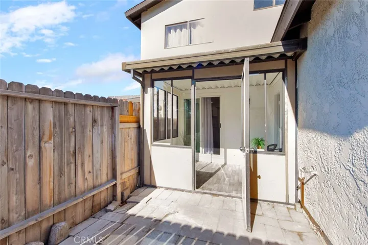 enclosed sun room opens to kitchen, garage and back patio