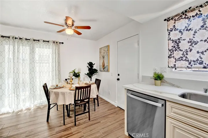 New kitchen cabinets and appliances lighting and ceiling fan.  gas stove. door to back patio.  sliding door to side patio and eclosed sun room