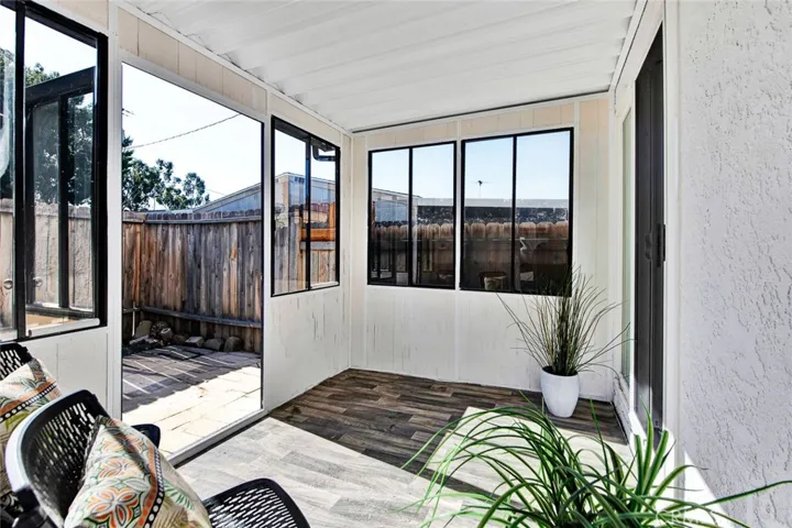 enclosed sun room opens to kitchen, garage and back patio