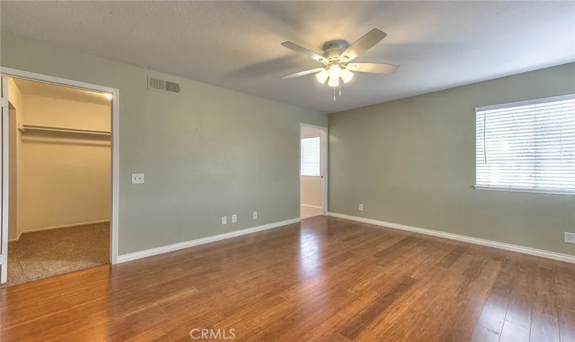 walk in closet in primary bedroom