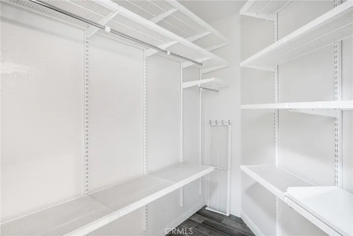 Closet with built in moveable racks and shelving