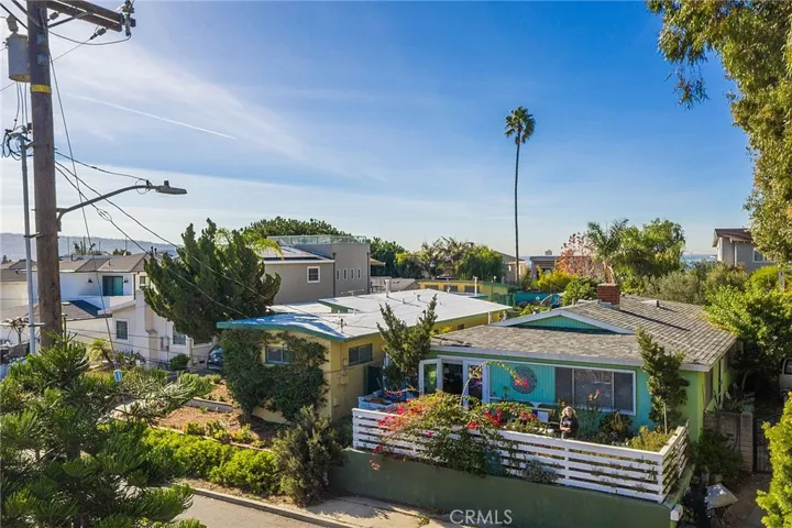 Drone photo of ocean view from approximately 25 feet above the sidewalk in front of the home.