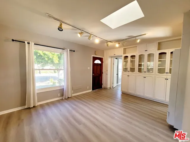 Spacious Living room with skylight & built-ins