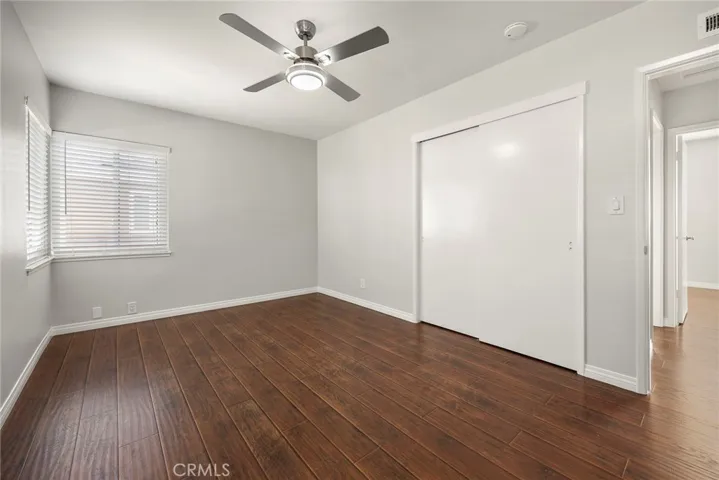 Bedroom 1 with double door closet and new stainless ceiling fan