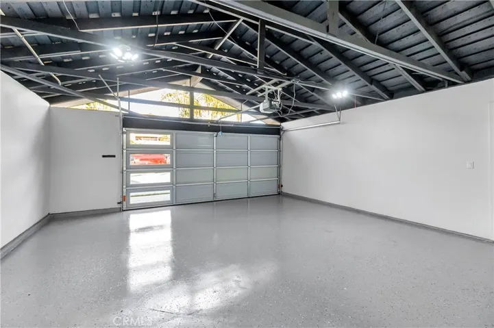 Epoxy Coated Garage Floors, LED Lighting and Custom Paneled Glass Door