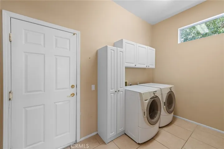 Inside laundry with lots of storage.