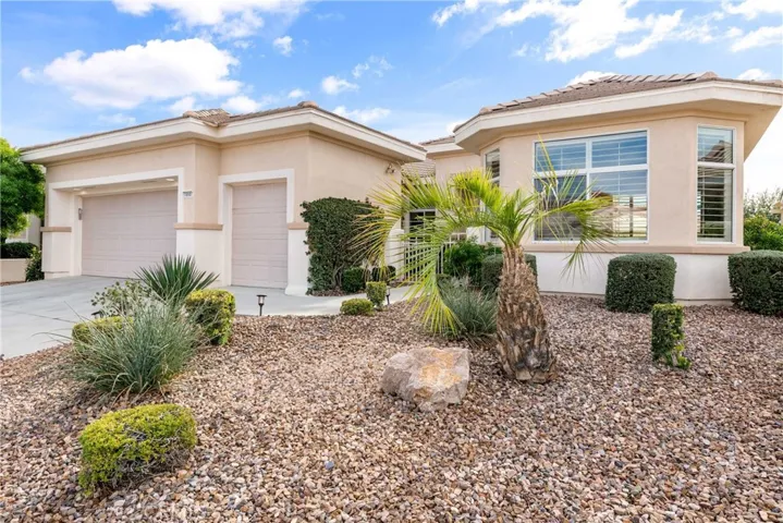 Two car garage plus golf cart garage. Low maintenance, desert landscaping.