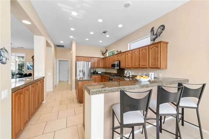 Spacious granite countertops.  Stainless steel appliances.  Ample storage cabinets.