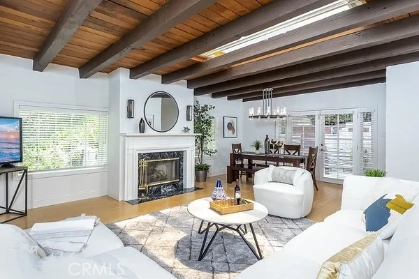 Previously staged. Open living room with formal dining room.