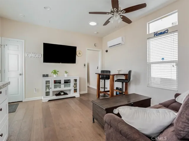 Open floor plan with wood floors.