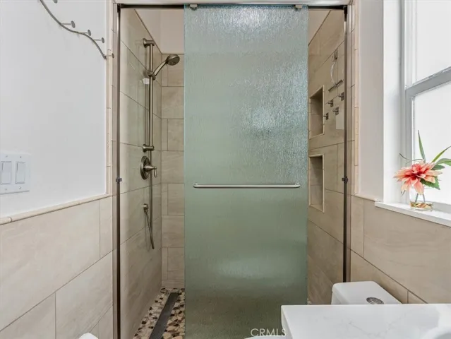 Fully tiled walk in shower.
