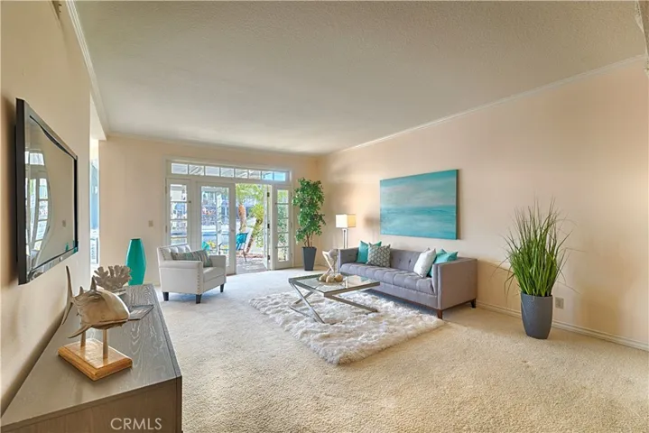 living room with doors to backyard