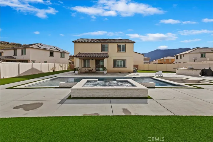 Beautiful pool with relaxing spa and sunken fire pit area