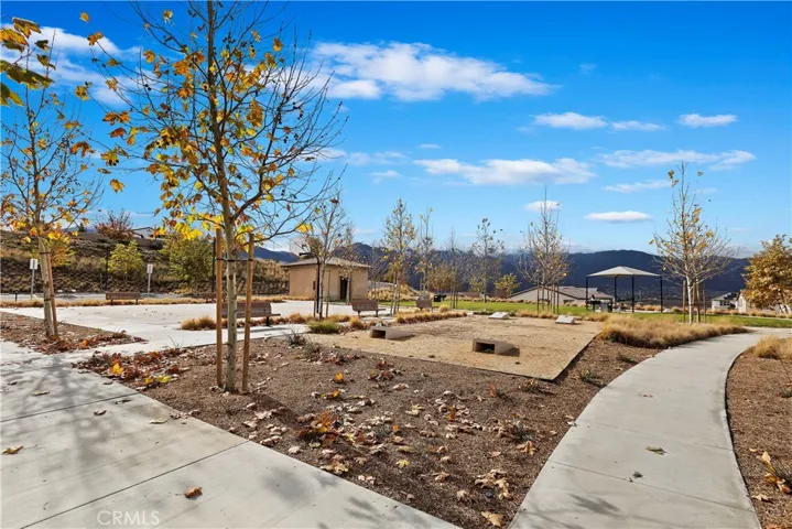 Community park with corn hole and basketball