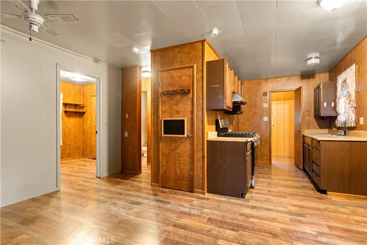 The door in the kitchen is to the laundry/ office/ storage and access to the downstairs storage area. The n
