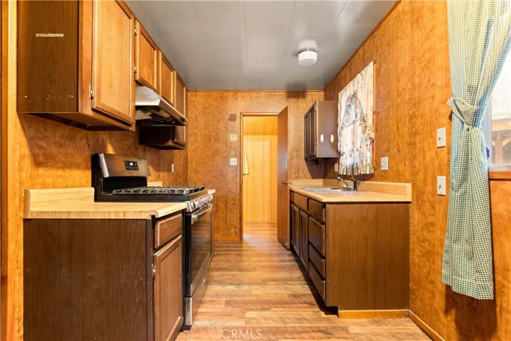 Full view of the kitchen with lots of cabinets.