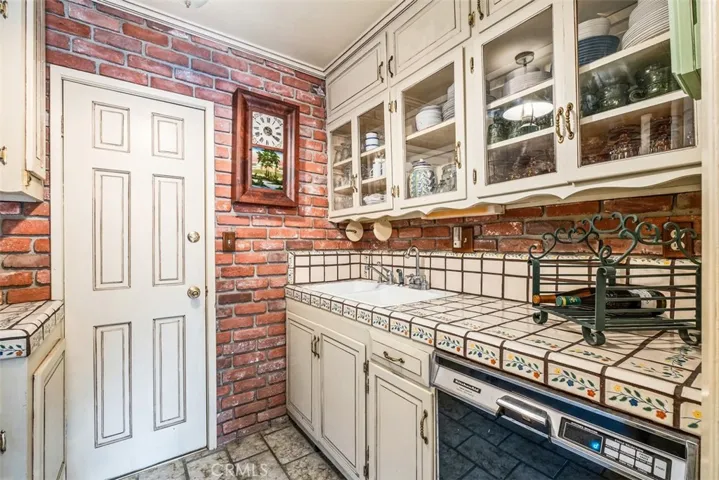 Butler's pantry with door accessing garage.