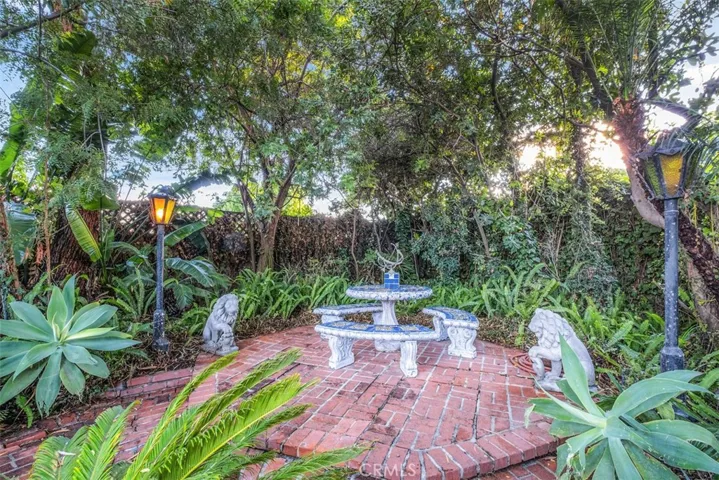 Brick seating area in garden.