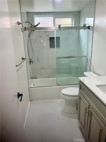 Hallway remodeled bathroom with tub