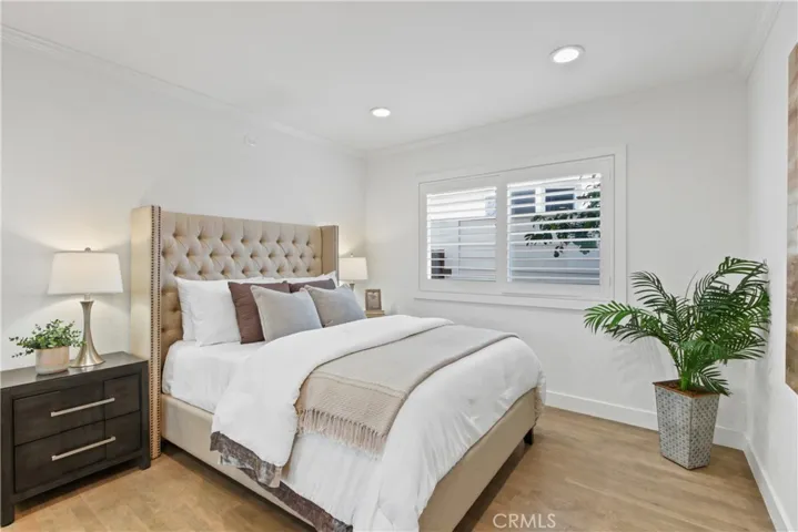 Main floor bedroom with mirrored closet doors