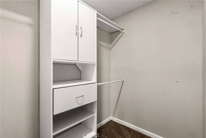 Ample storage at primary bedroom closet