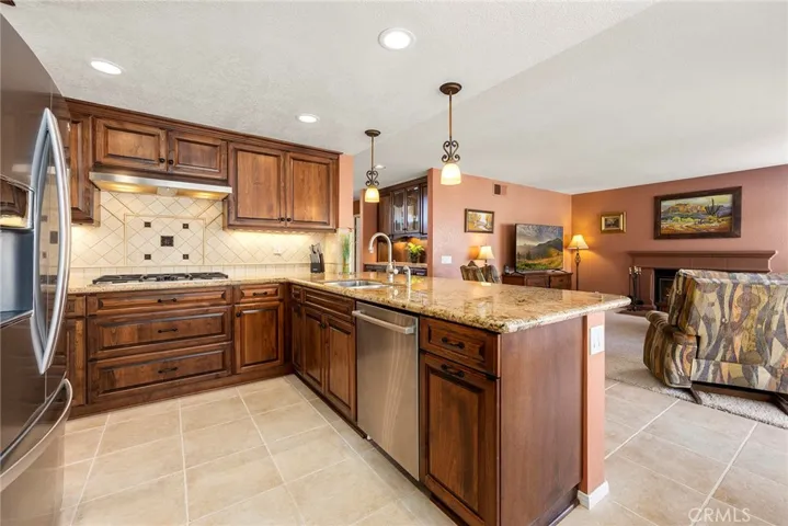 Chef's kitchen with upgraded stainless steel appliances.