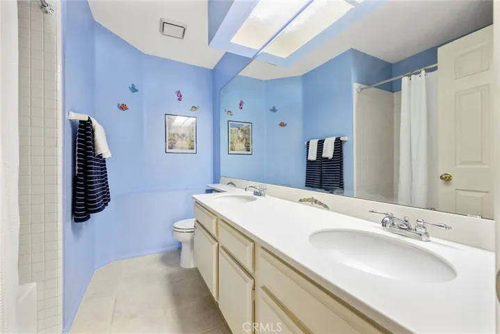 2nd floor hall bathroom with dual sink, large shower & tub.