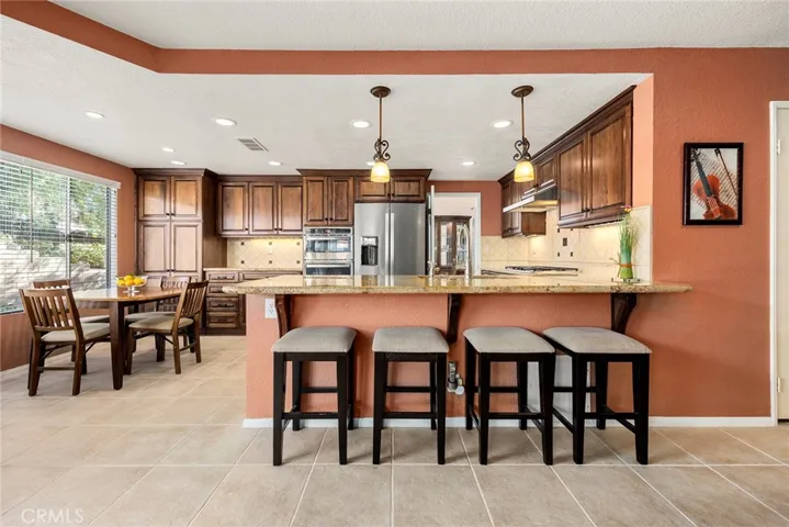 Gorgeous upgraded kitchen with loads of pantry and counter space with eat in counter bar!