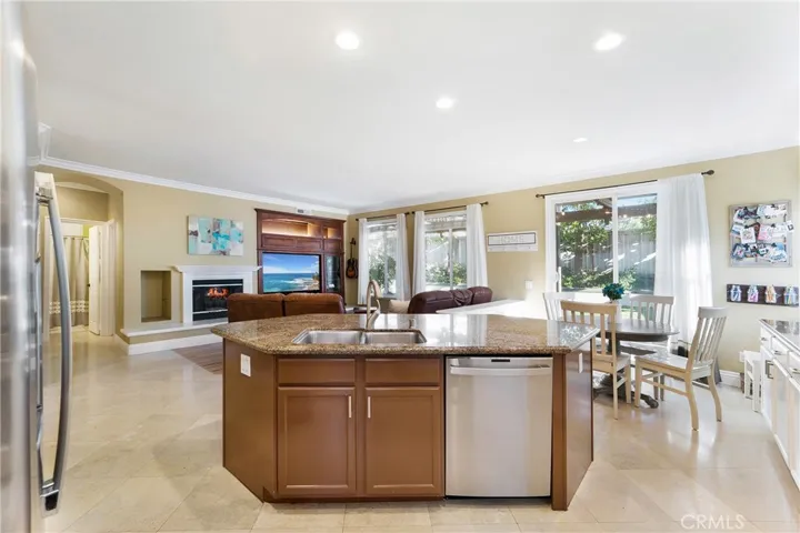 The gourmet kitchen opens to the family room.