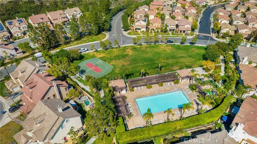 Looking down upon one of the community pools, fields and sport courts.