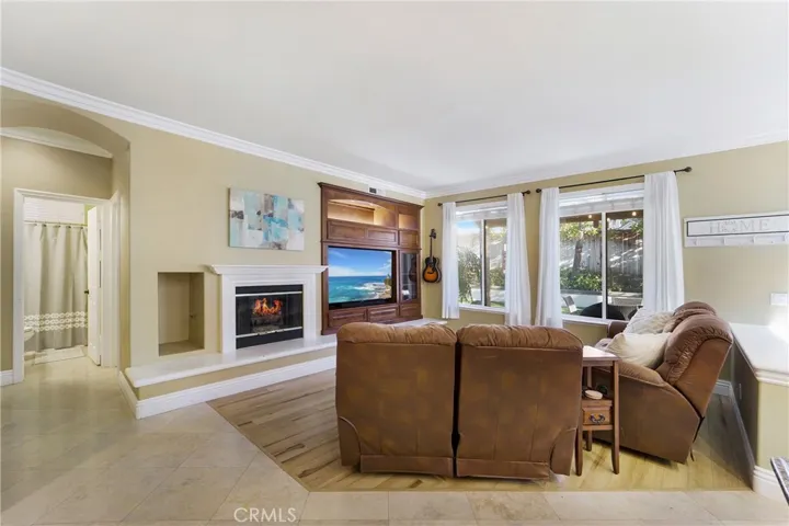 Cozy gas fireplace and built in entertainment center.